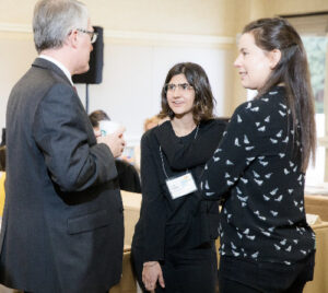 PhD student Lucía Abascal (center) speaking with IGHS staff