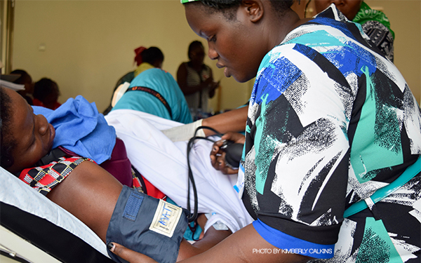 Nurse takes a pregnant woman's blood pressure