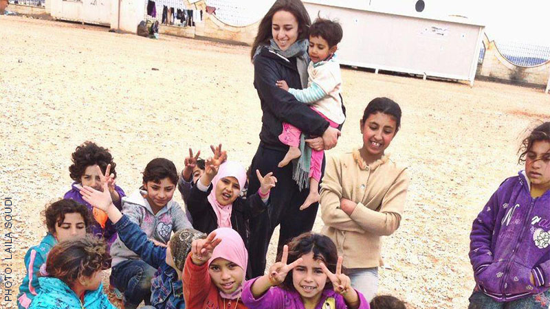UCSF Global Health Sciences alumna Laila Soudi with children in refugee camp