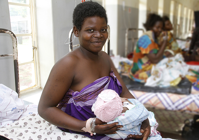 A mother with her premature baby in Uganda. The baby wears a tiny hat for warmth. The tiny hat was part of a 2017 and 2018 campaign to bring thousands of tiny hats to tiny babies in low-income countries and help spread awareness of the global epidemic of preterm birth. The Global Maternal Newborn Child Health Research Cooperative at IGHS partnered with the American Academy of Pediatrics and the Warm Up America! Foundation to lead the Tiny Hats campaign. Photo by Ludowa Abubakar, 2018.