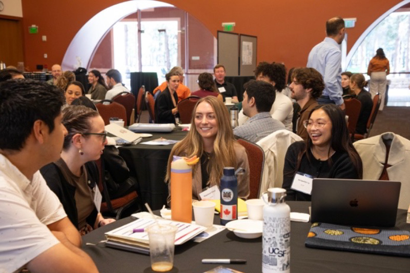 Attendees chat during the networking activity. From left to right: Sydney Fine, Mayland Treat, Jacquelyn Ly.