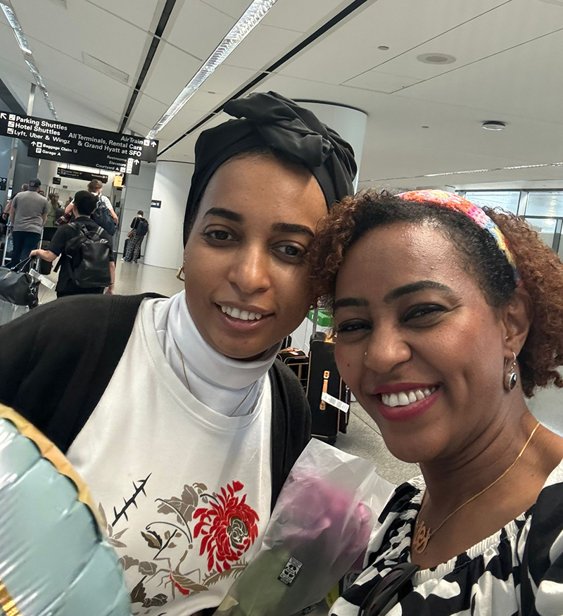 Amira Adam greeted Sahar Rawda, fellow Global Scholar from Sudan, when she arrived safely at the airport