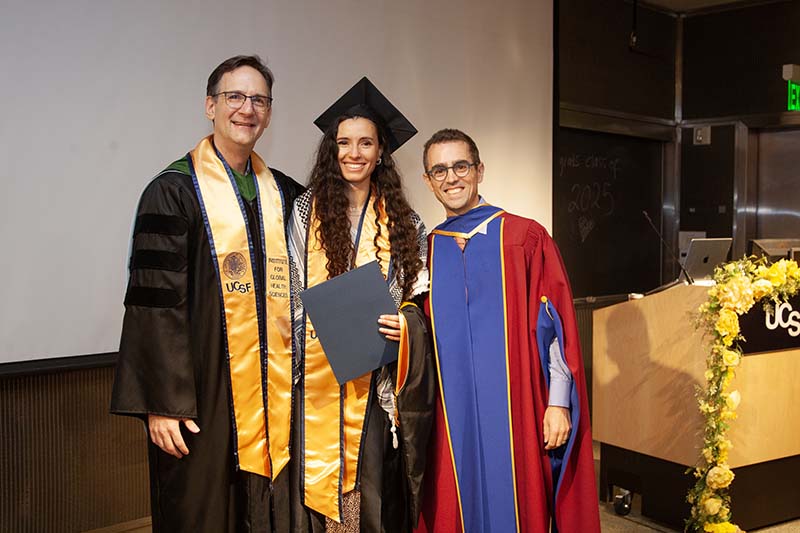 Zeena Khazendar between former Program Director Chris Carpenter and Associate Director Alden Blair